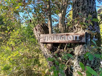 a sign that says horologist attached to a tree at 6 person holiday home in LEKSVIK in Leksvik