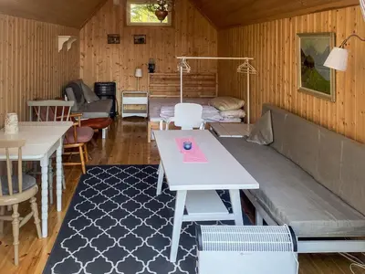 a living room with a couch and a table at 6 person holiday home in LEKSVIK in Leksvik