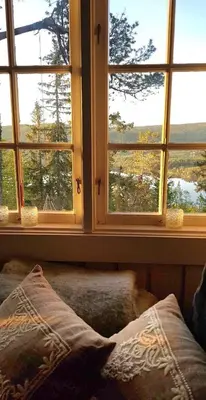 a bedroom with two windows and a bed with a view at Cabin in Kongsberg, Jondalen in Kongsberg