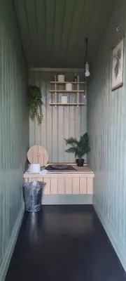 a room with a bench and plants in it at Cabin in Kongsberg, Jondalen in Kongsberg