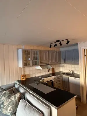 a kitchen with a black counter top in a room at Beautiful apartment at Ustaoset in Hol
