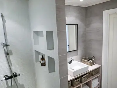a bathroom with a sink and a mirror at Holiday Home Lauvlid Cottage by Interhome in Tysnes