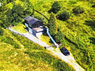 an aerial view of a house in a field at Holiday Home Lauvlid Cottage by Interhome in Tysnes