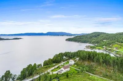 an aerial view of the shoreline of a lake at Apartment in peacefull surroundings in Ådnavik