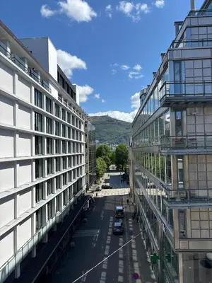a view of a street between two buildings at Stay in the middle of Bergen city centre! in Bergen