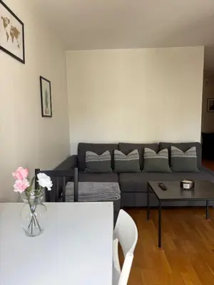 a living room with a couch and a table at Stay in the middle of Bergen city centre! in Bergen