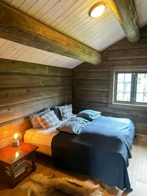 a bedroom with two beds in a log cabin at Log Cabin With Views Of Jotunheimen in Øyer