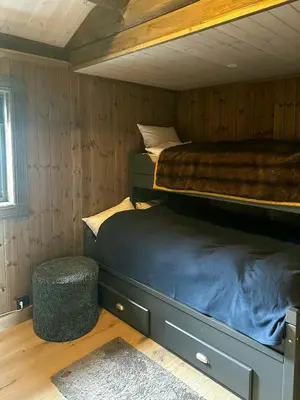 a bedroom with two bunk beds in a room at Log Cabin With Views Of Jotunheimen in Øyer