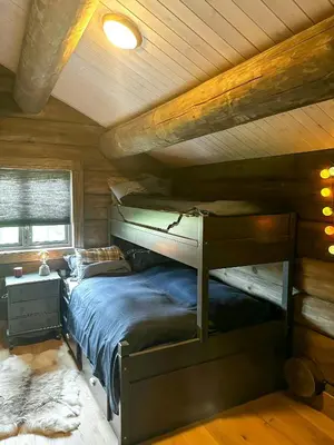 a bedroom with a bunk bed in a cabin at Log Cabin With Views Of Jotunheimen in Øyer