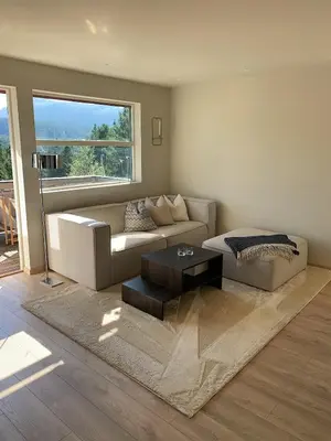 a living room with a couch and a coffee table at Bright and nice apartment in Kristiansund