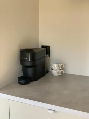 a coffee maker sitting on top of a counter at Bright and nice apartment in Kristiansund
