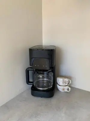 a black coffee pot sitting on top of a counter at Bright and nice apartment in Kristiansund
