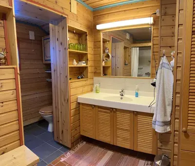 a bathroom with a sink and a mirror at Very central and by the lake Sjusjøen in Ringsaker