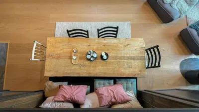 a wooden table with pillows on the floor at Modern Cabin With Mountain Views In Rauland in Rauland