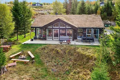an aerial view of a small house with a deck at Family Cabin With Views Over Hadeland in Lunner