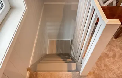 a staircase in a house with white walls at Lovely Home In Mausund With Wifi in Bogøyvær