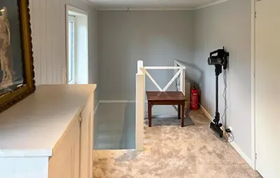 a room with a table and a chair and a camera at Lovely Home In Mausund With Wifi in Bogøyvær