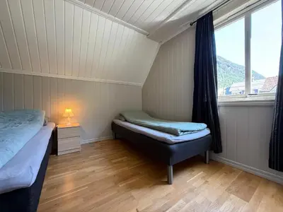 a small room with two beds and a window at Tveitopark Apartments B in Rjukan