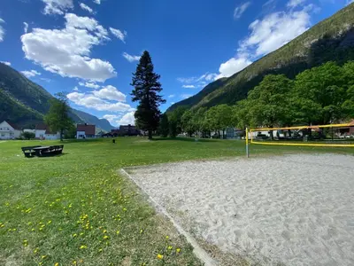 a field with a soccer ball and a goal at Tveitopark Apartments B in Rjukan