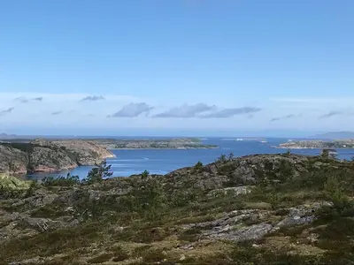 a view of the ocean from the top of a mountain at Cabin with stunning views and outdoor jacuzzie in Leset