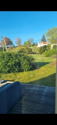 a view out of a window of a road with a field at Charming family house with beautiful views! in Askøy