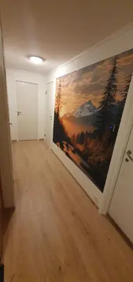 a room with a large painting on the wall at Fotlandsvåg Guest Apartment in Bernes