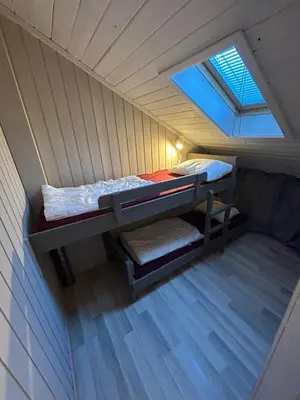 a small room with a bunk bed in the attic at Nice apartment at Golsfjellet in Gol