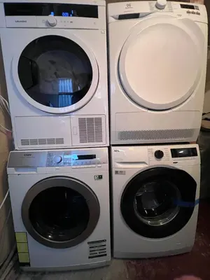 two washing machines and a dryer next to each other at Bergen City Retreat - Steps from Bryggen - Norwegians Minimum Age 25 in Bergen