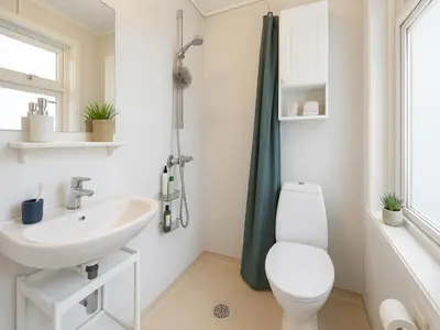 a bathroom with a toilet and a sink at Bergen City Retreat - Steps from Bryggen - Norwegians Minimum Age 25 in Bergen
