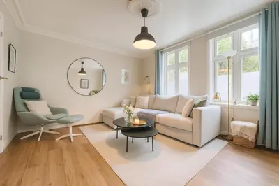 a living room with a couch and a table at Trio Central in centre - Norwegians Minimum Age 25 in Bergen