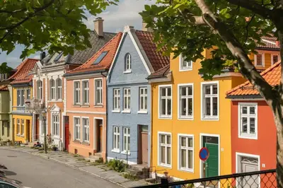 a row of colorful houses on a street at Cozy loft with king bed in the middle of town in Bergen