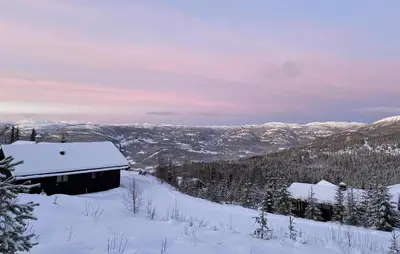 a cabin in the snow with a view of the mountains at Awesome Home In Eggedal With Sauna in Eggedal