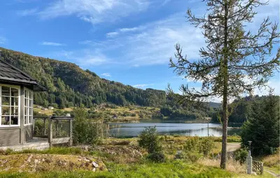 a house with a view of a lake at Stunning Home In Korssund With Wifi in Korssund