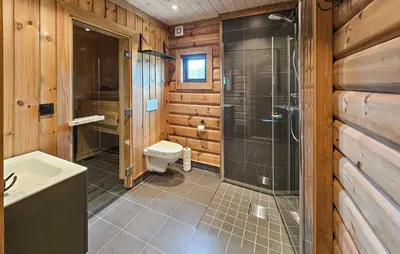 a bathroom with a toilet and a glass shower at Nice Home In Gol With Sauna in Gol