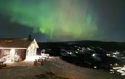 a cabin under the northern lights in the sky at Nice Home In Gol With Sauna in Gol