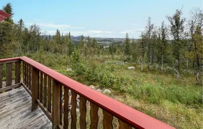a wooden deck with a view of a forest at 4 Bedroom Lovely Home In Nord-Torpa - N31585 in Nord Torpa