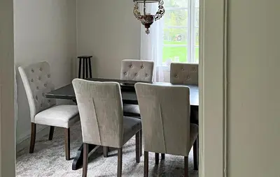 a dining room table and chairs with a table and a window at Gorgeous Home In Eikesdal - N28170 in Verma