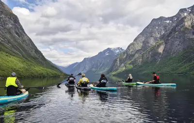 a group of people kayaking on a lake in the mountains at Gorgeous Home In Eikesdal - N28170 in Verma