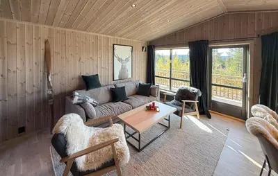 a living room with a couch and a table at 2 Bedroom Beautiful Home In Gålå in Gålå