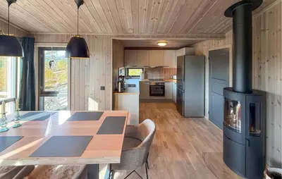 a kitchen with a table and a stove in a room at 2 Bedroom Beautiful Home In Gålå in Gålå