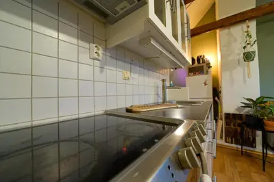 a kitchen with a sink and a counter top at Penthouse in Bergen