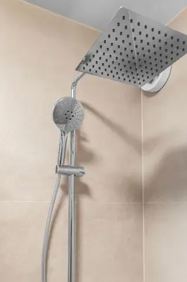 a shower with a shower head in a bathroom at Modern Apartment in the Heart of Bergen in Bergen
