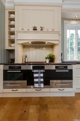 a large kitchen with a stove top oven at Villa Grøndalen Gård in Trysil