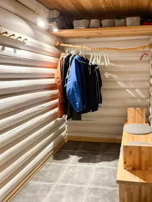 a walk in closet with a wooden wall at Modernized Log Cabin At Ljøsheim in Sjusjøen