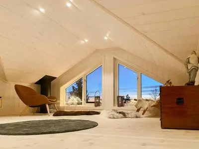 a living room with a large room with a large window at Family Cabin With Views In Lygnalia in Jaren