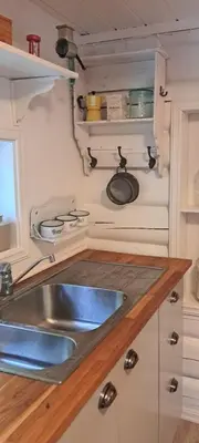 a kitchen with a sink and a counter at Traditional Log Cabin By Lake Seljord in Seljord