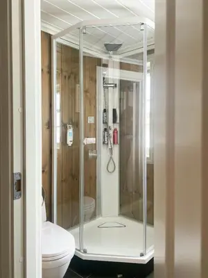 a glass shower in a bathroom with a toilet at Family Cabin By The Ski Trails In Rauland in Seljord