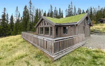 a small wooden house with a grass roof at Lovely Home In Gålå With Sauna in Gålå