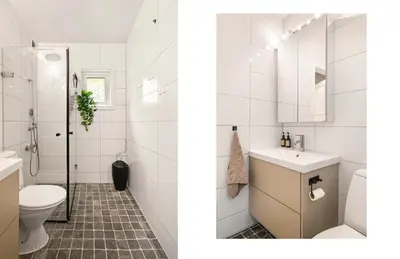 a white bathroom with a toilet and a sink at Solheimslien in Bergen