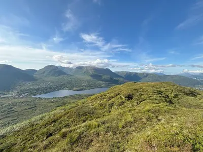 a view from the top of a mountain with a lake at Modern cottage in the heart of the Sunnmøre Alps in Sykkylven